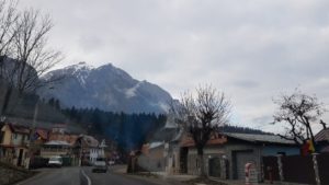 Lovely Brasov with the snow mountains. Romania - Home of Bran “Dracula” Castle