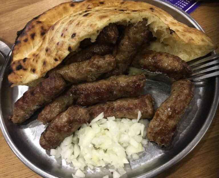 Cevapi with onions. solo traveller in Sarajevo, Bosnia and Herzegovina.