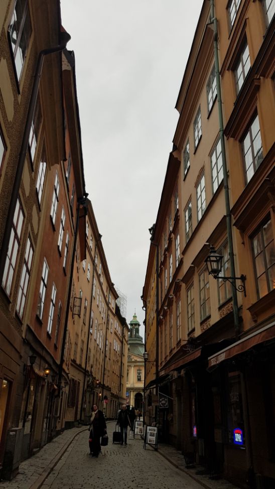 Narrow street in Gamla Stan - Stockholm, Old Town,. Sweden is a cold and cashless society.