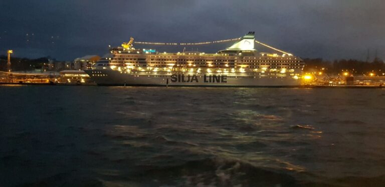 Night view of the city and the Vikings inter-island ferry. Finland is the happiest country on earth