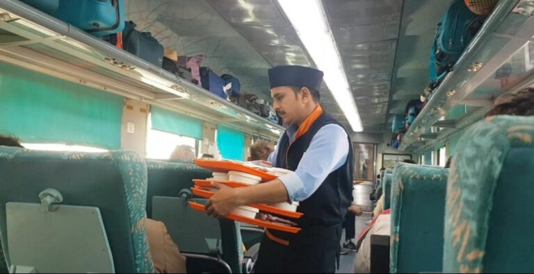 Service in the Second-Class train - New Delhi, India. India, the most populated country on earth