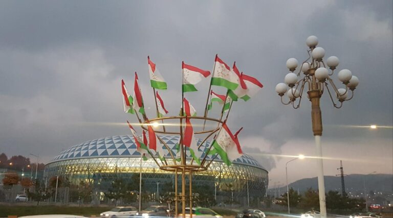 Sports Complex in Dushanbe and the Tajikistan flag. Tajikistan, the Smallest Country in Central Asia