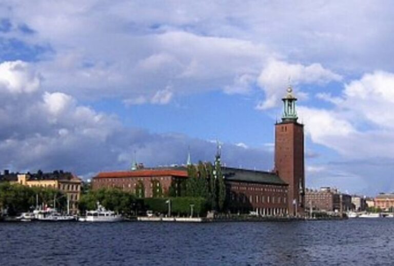 The Stockholm City Hall across Lake Malaren. Sweden is a cold and cashless society.