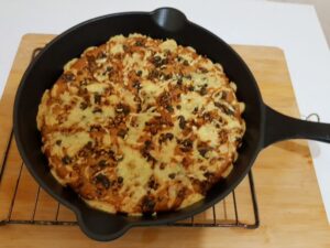 Garlic and capers flat bread on flaxseed dough. (baked in cast iron pan). The benefits of cooking as a hobby